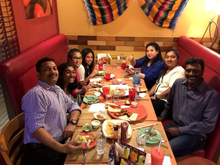Family gathering over a full table at Frank’s A Lot